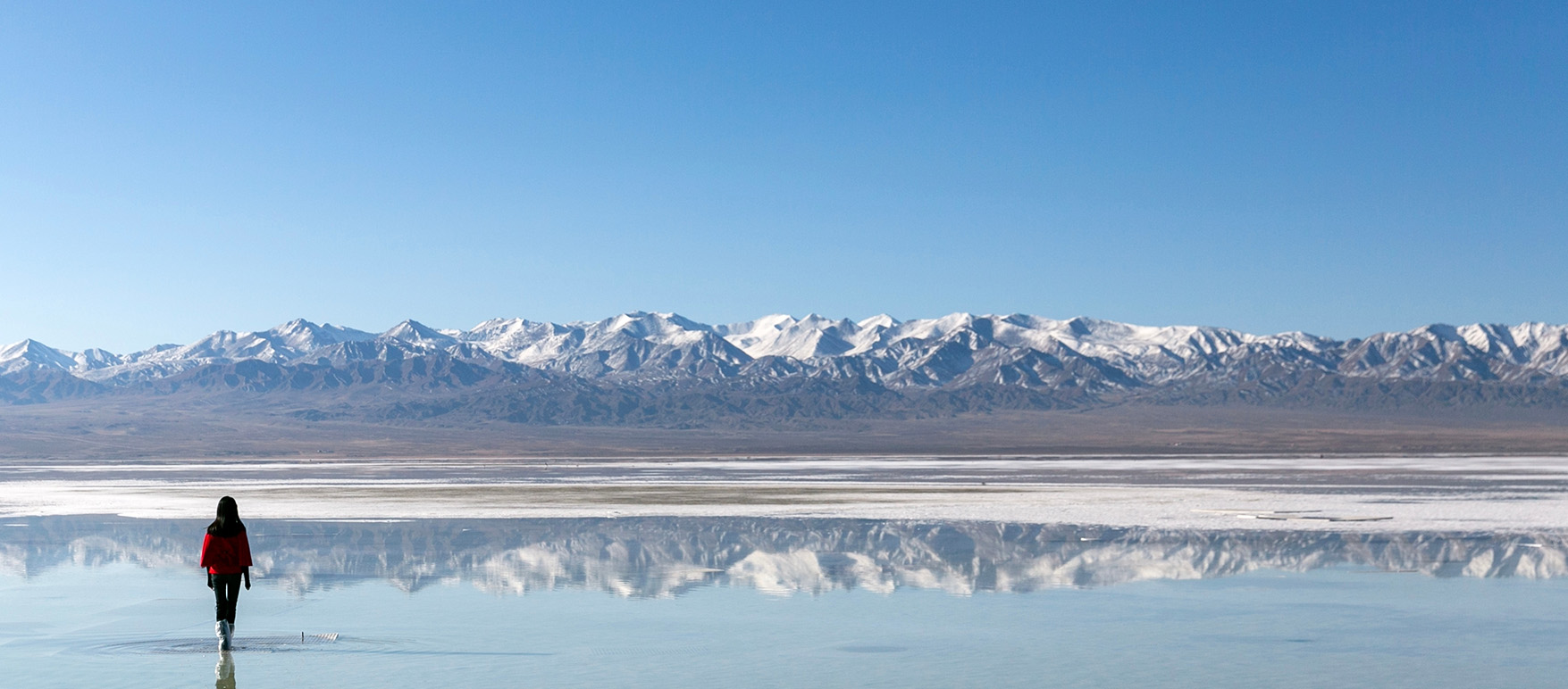 Salt lake with snow mountains